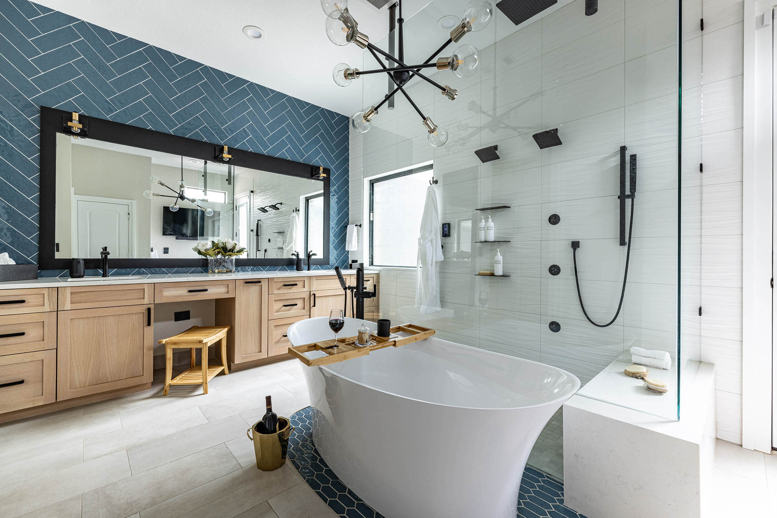 Birkenfeld_Bathroom renovation with standing tub eyecandy light fixture walk-in shower with multiple shower heads custom blue accent tile custom cabinetry in Keller Texas