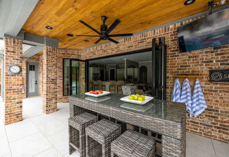 Birkenfeld_Custom 15-food indoor-outdoor doorway from living room to patio area with outdoor dining table in Keller Texas