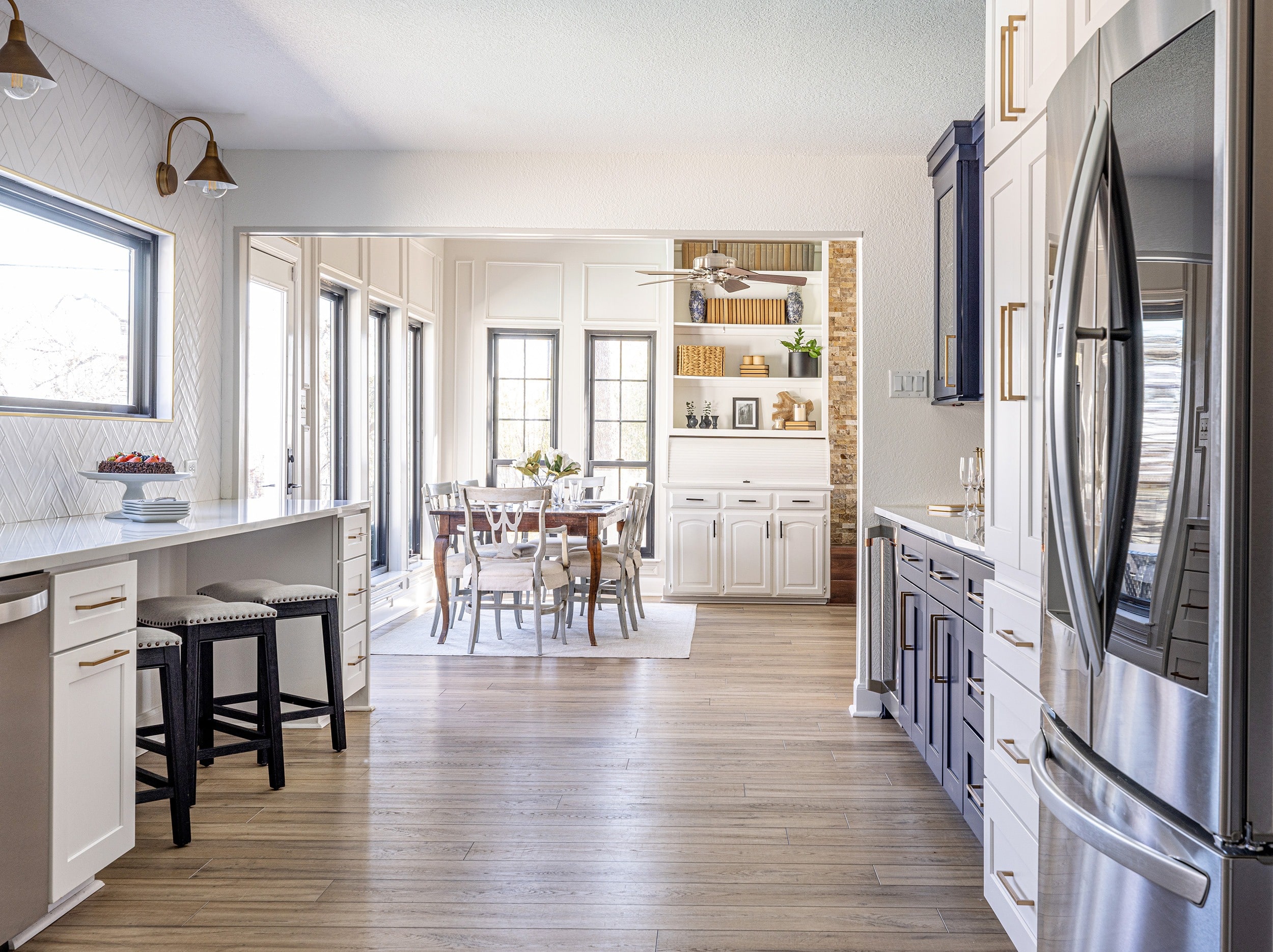 Guerin_Kitchen renovation with custom cabinetry and adjacent dining area and large fridge and focal blue paint cabinets in Trophy Club Texas