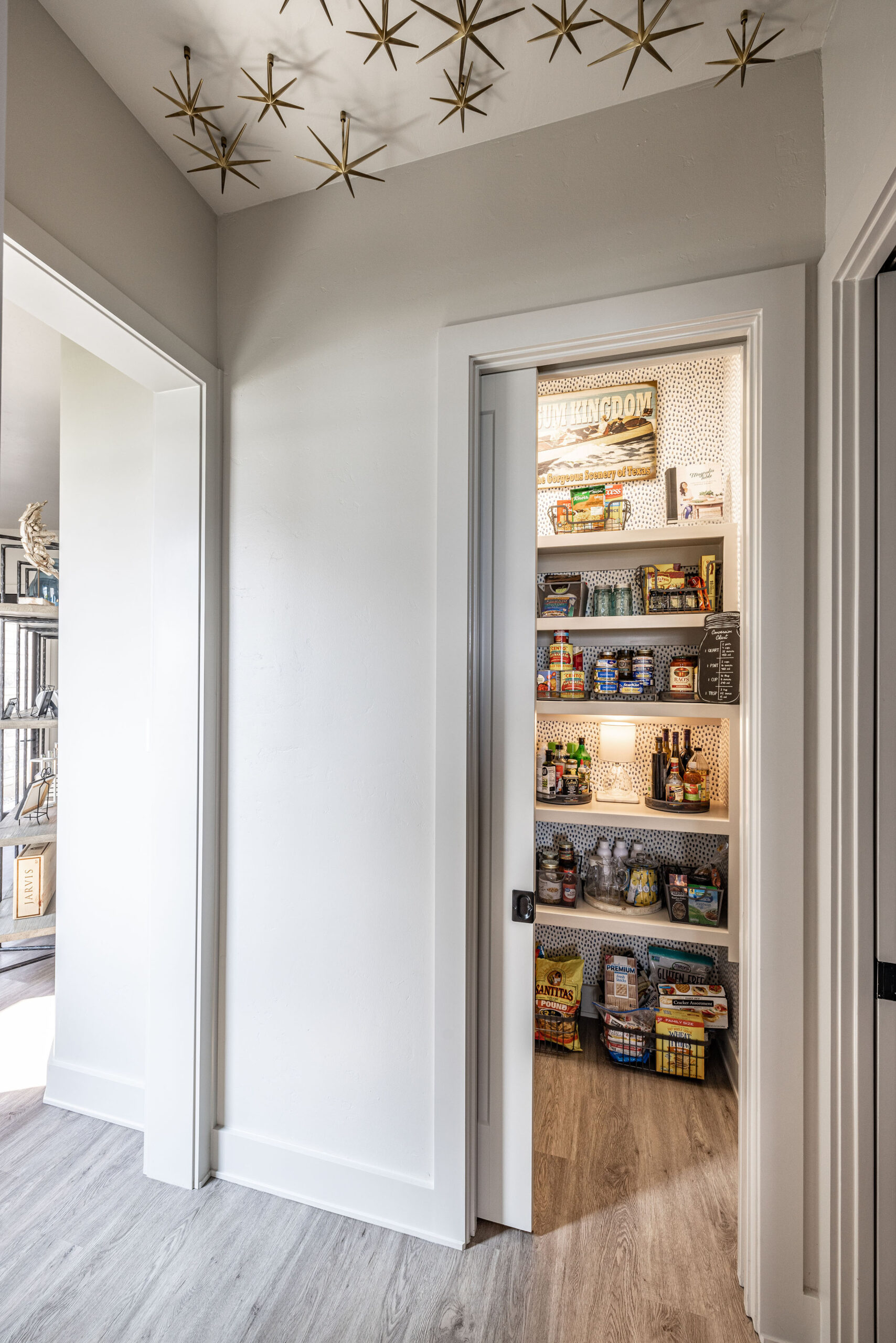 Lake house_Custom pantry with automatic ighting and bronze star artwork on the ceiling in second home vacation property in Possum Kingdom Lake Texas