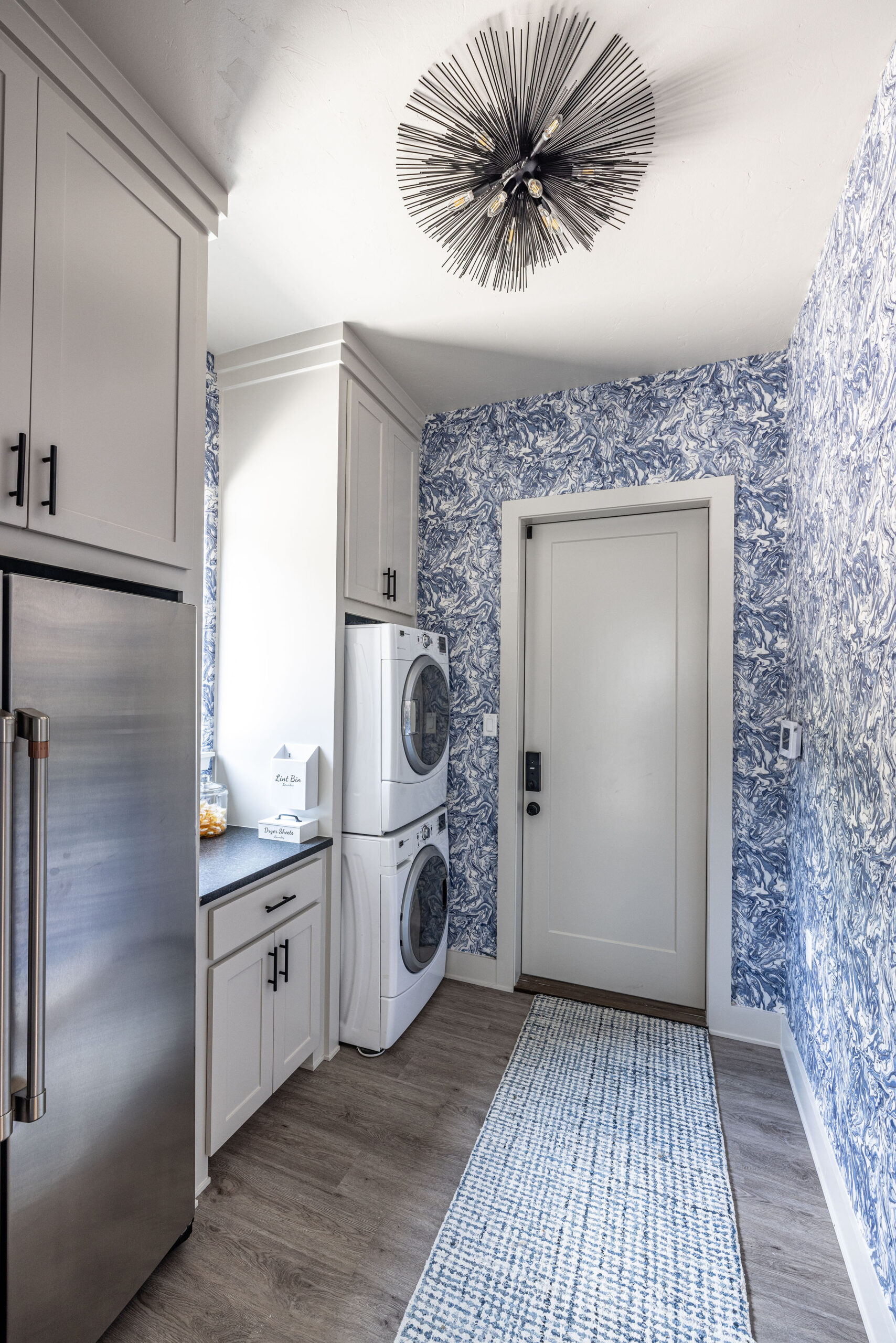 Lake house_Laundry room with eyecandy light fixture and exceptional detailed wallpaper in second home vacation property in Possum Kingdom Lake Texas