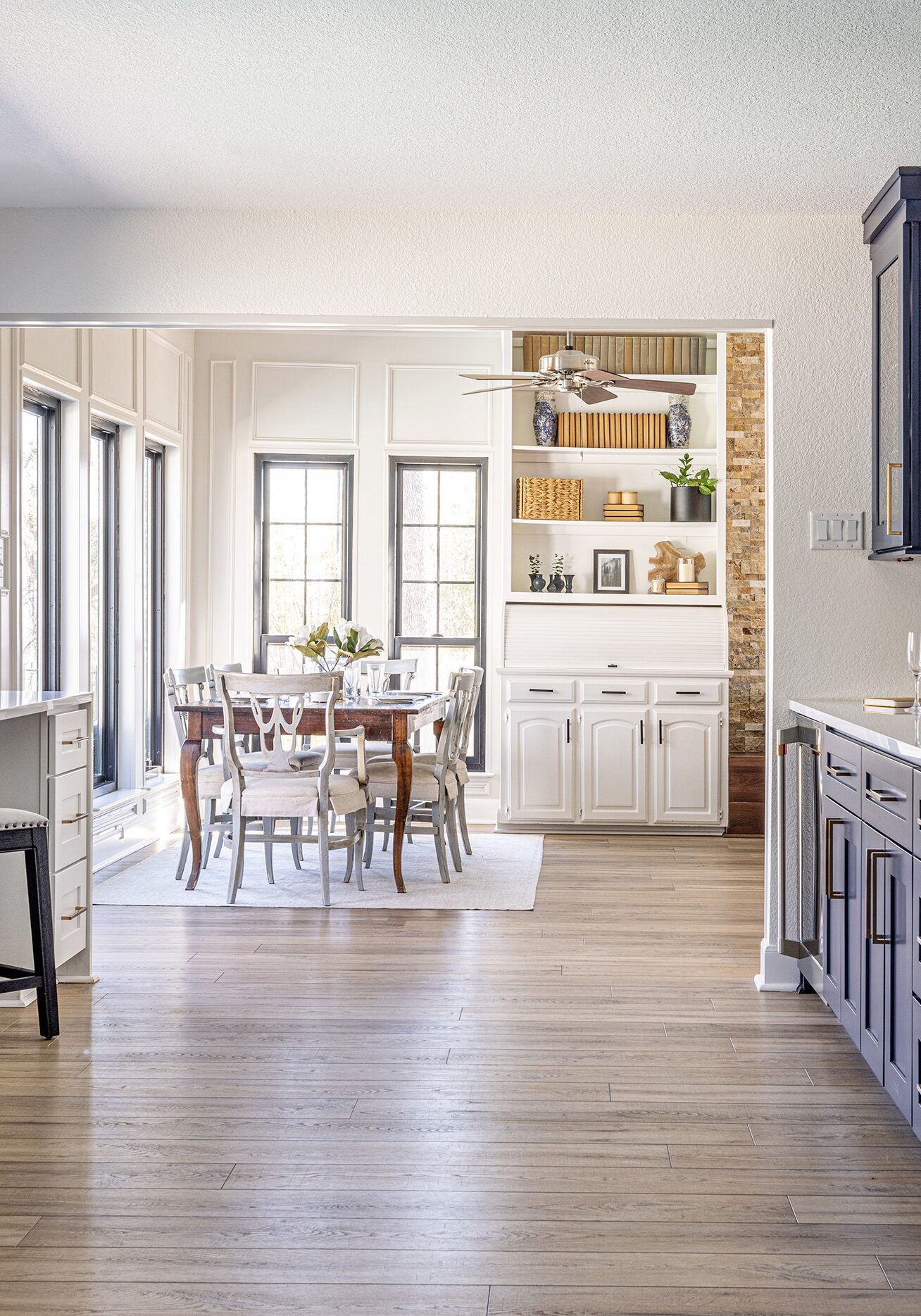 Guerin_Kitchen renovation with custom cabinetry and adjacent dining area and large fridge and focal blue paint cabinets in Trophy Club Texas